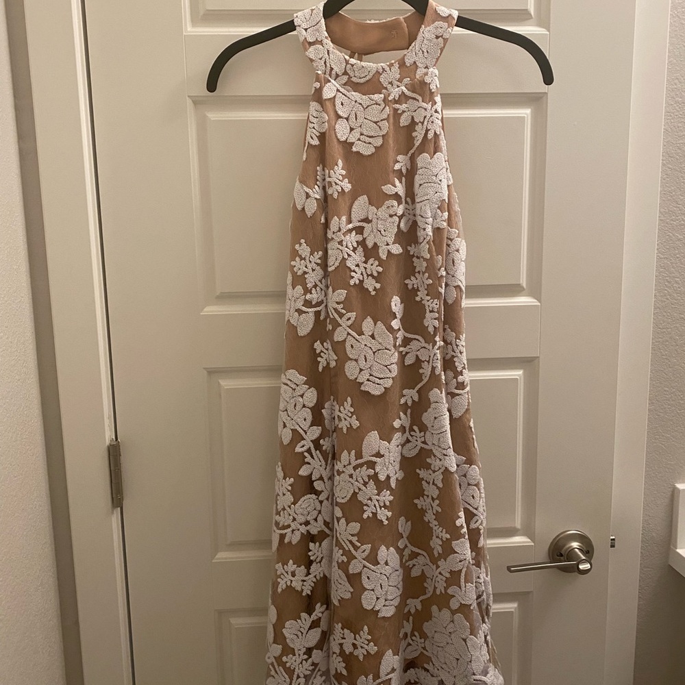 Beautiful beaded and lace swing dress by Dress the Population